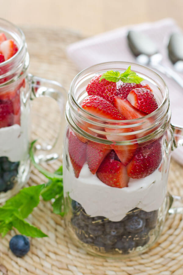 Whipped coconut cream with strawberries and blueberries