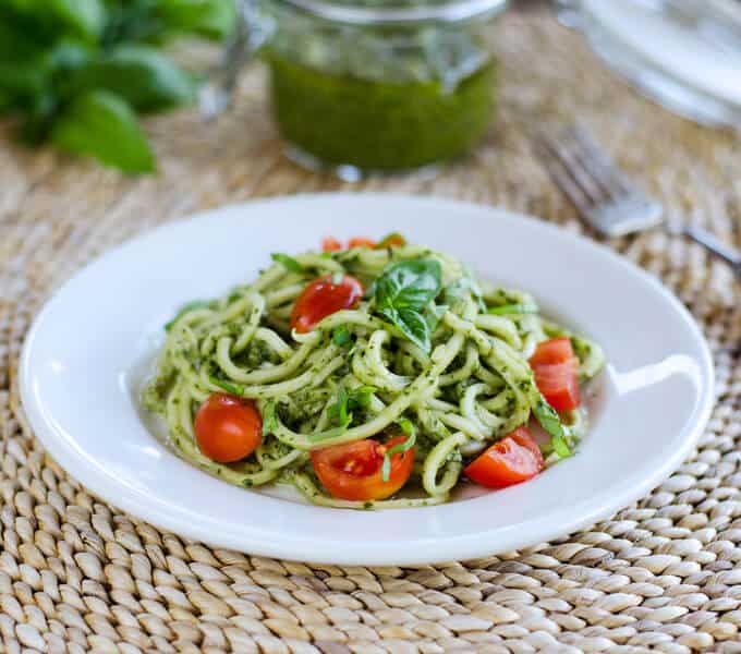 With fresh basil pesto, homegrown zucchini and tomatoes, this quick and easy zucchini pasta pesto is paleo, gluten-free, and dairy-free. | cookeatpaleo.com