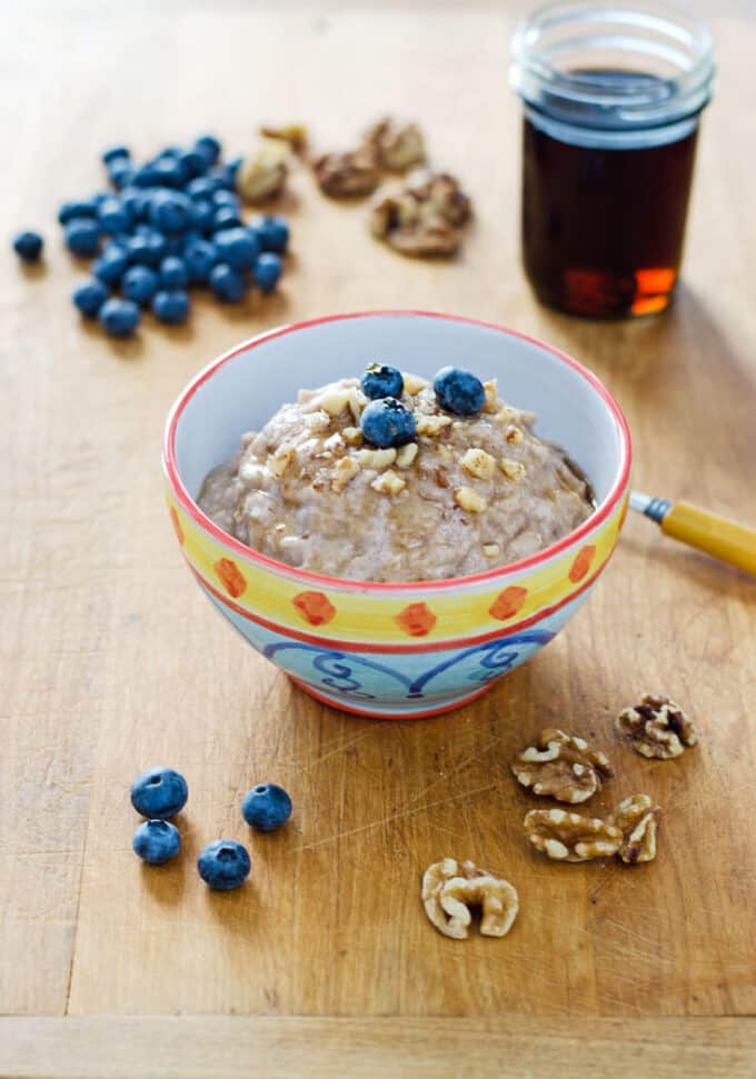 Paleo oatmeal with blueberries, walnuts and maple syrup