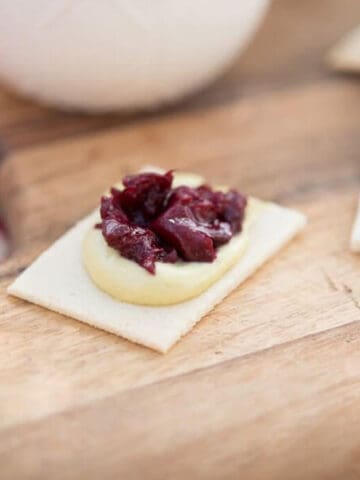 Basil cashew spread with cherry compote on grain-free cracker