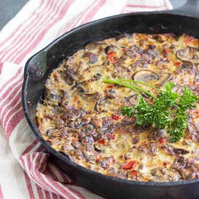 Sausage and mushroom frittata in cast iron pan