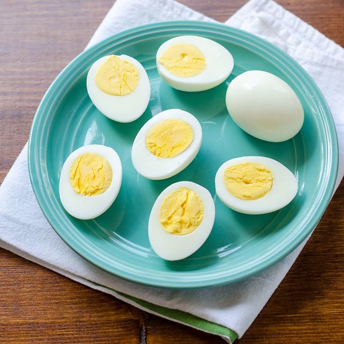 Hard boiled eggs cut open on plate