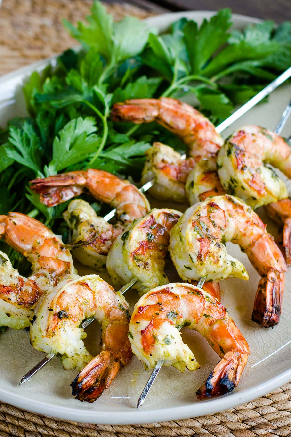 Grilled shrimp with chimichurri sauce on skewers with fresh parsley