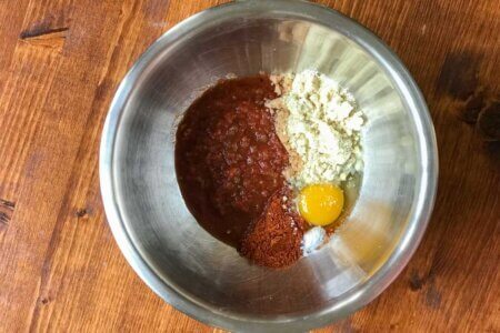Salsa, egg, almond flour, baking soda, and spices in mixing bowl