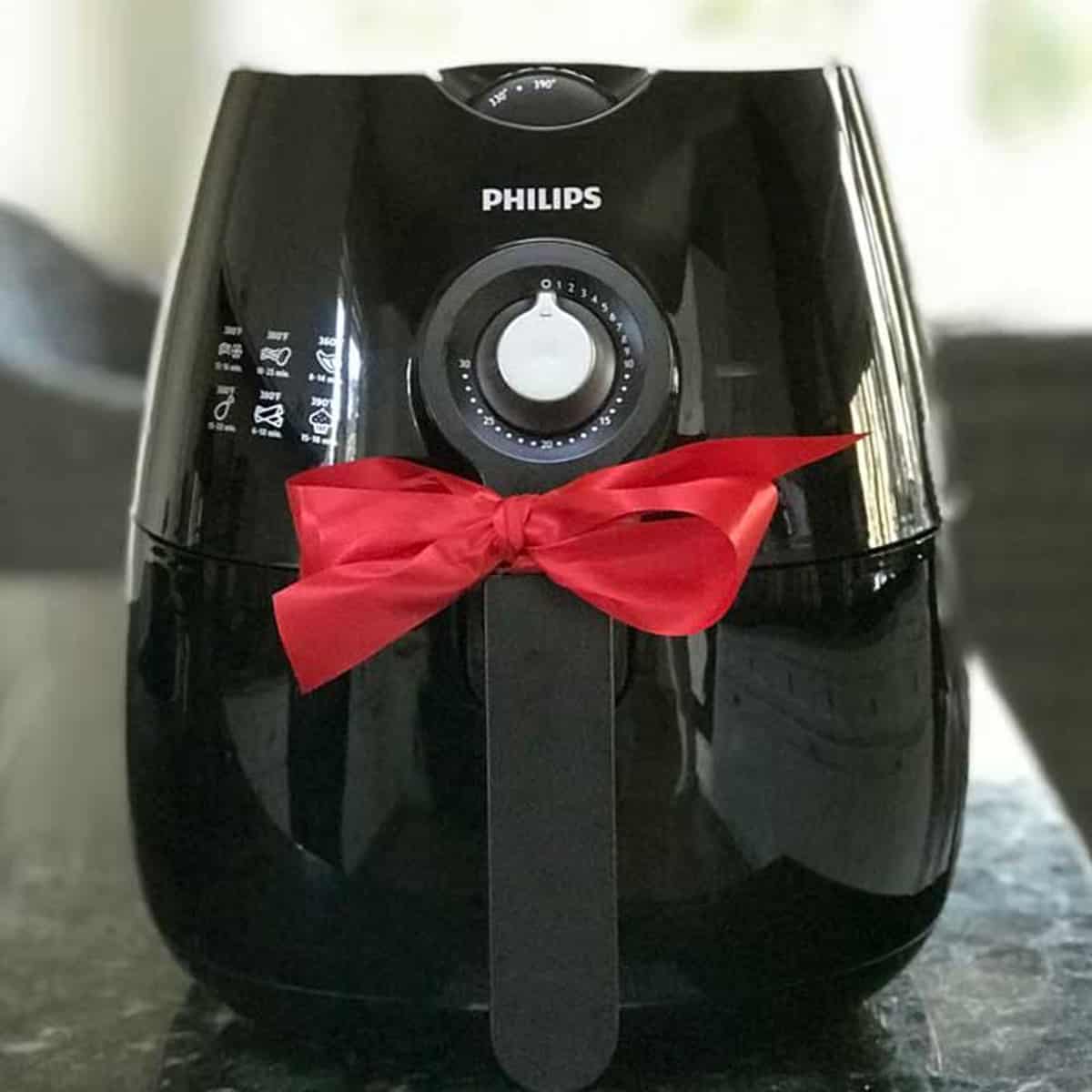 Air fryer with gift bow in kitchen