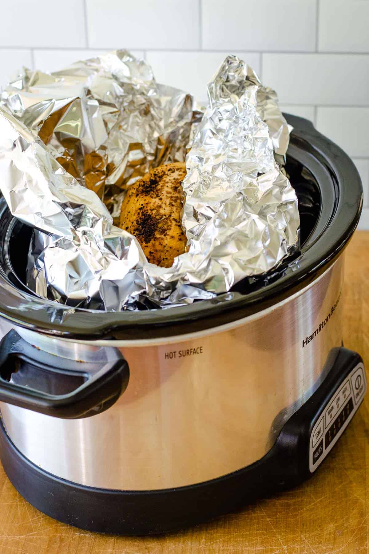 Whole chicken in foil in slow cooker