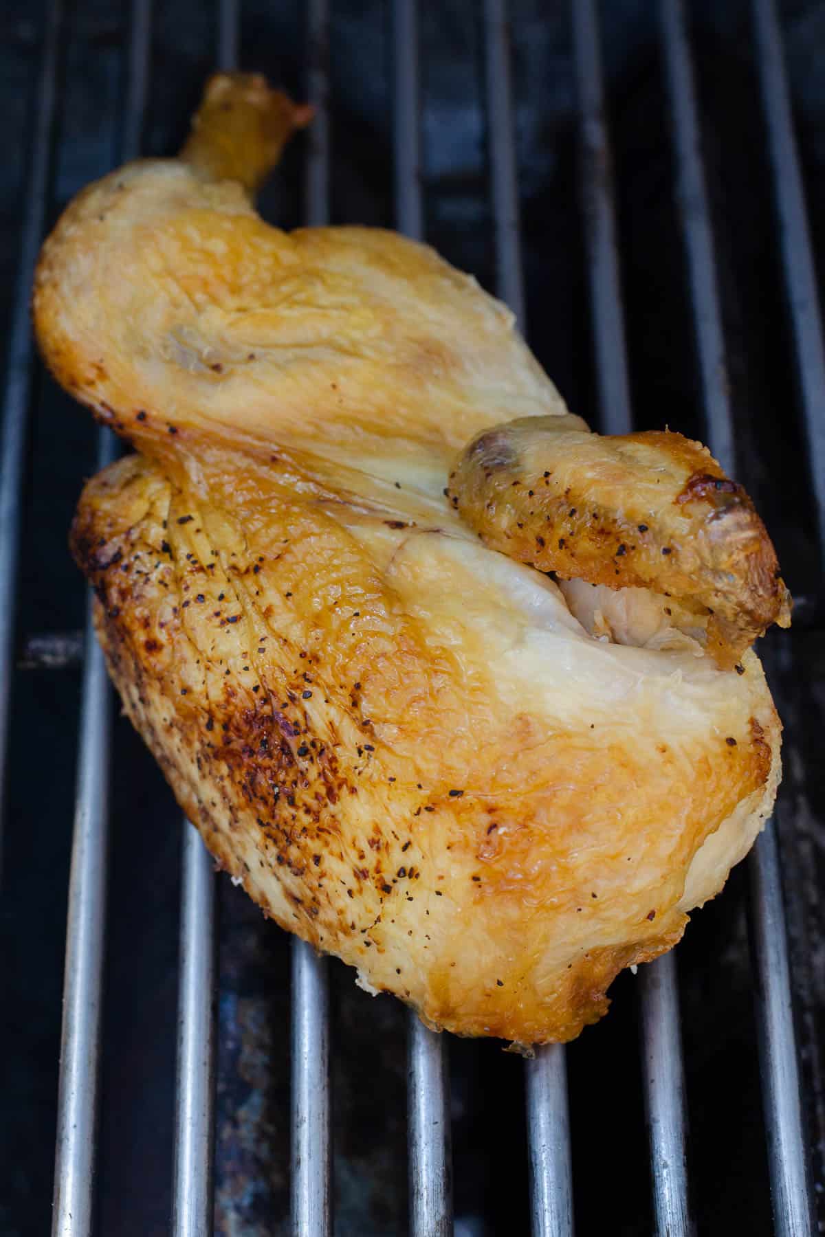 Half chicken on grill