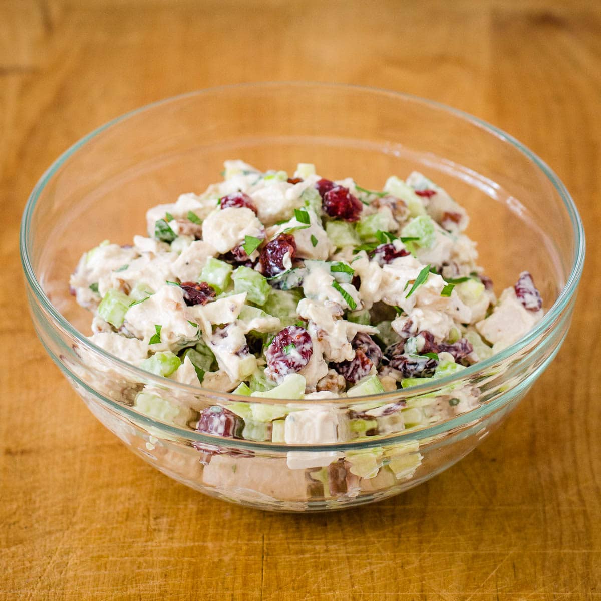 Turkey cranberry salad in glass bowl.