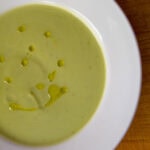 Easy broccoli soup with olive oil in a white bowl.