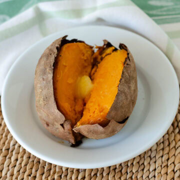 Baked sweet potato with ghee melting in the middle.